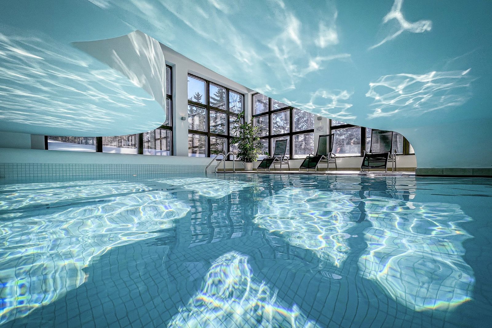 Hotel Cresta Palace, St Moritz - indoor pool with light shining in from large windows